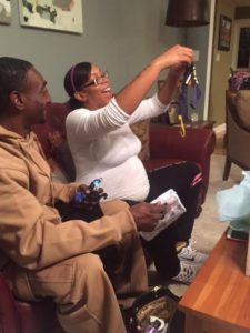 Victoria admires an outfit for her baby boy